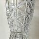 Vintage design vase in crystal. faceted patterns, braces. flared neck