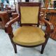 Armchair with scroll arms and sabre legs in mustard velvet, 19th century.