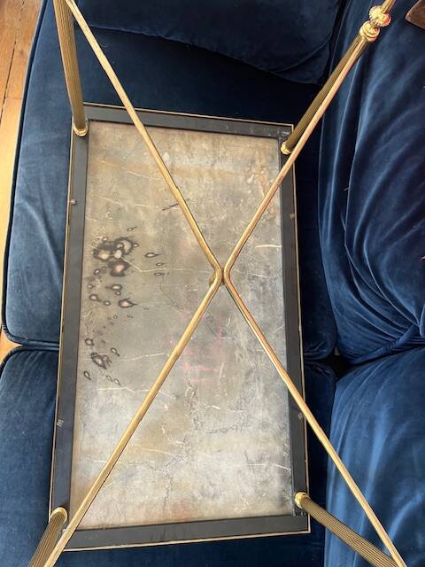 Black marble coffee table with brass legs.