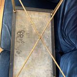 Black marble coffee table with brass legs.