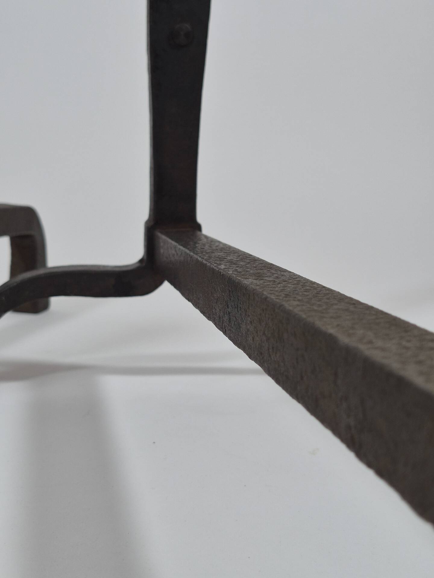 Pair of handforged metal and brass andirons