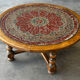 Vintage coffee table in turned wood and leather with astrological decoration.