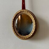 Small vintage wall mirror in gold painted wood