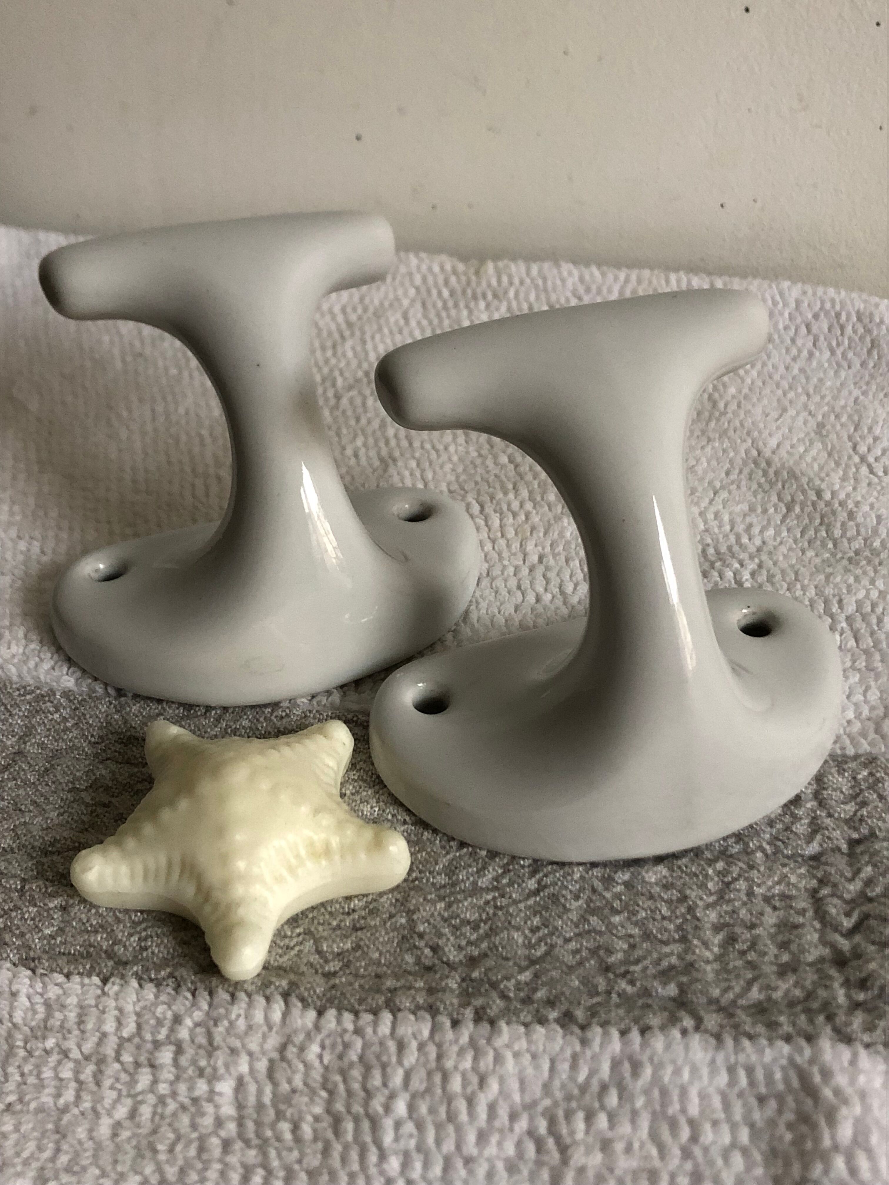 Pair of white porcelain hooks