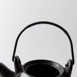 Vintage ceramic teapot from the 1980s, black with white stripes and a metal handle.