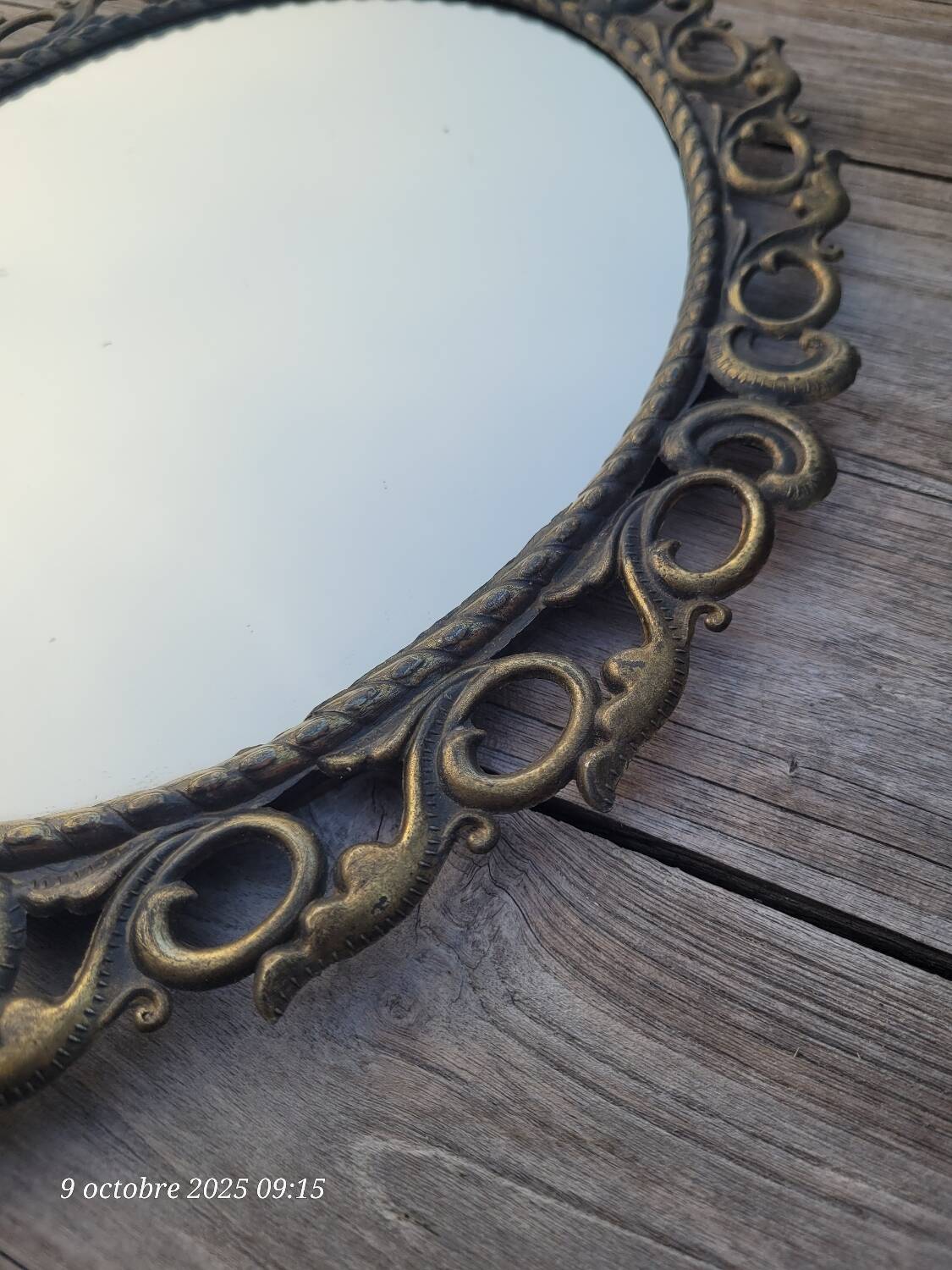 2 antique oval mirrors in heavy metal