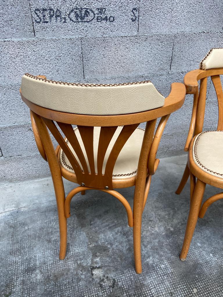 Pair of vintage curved wood restaurant armchairs