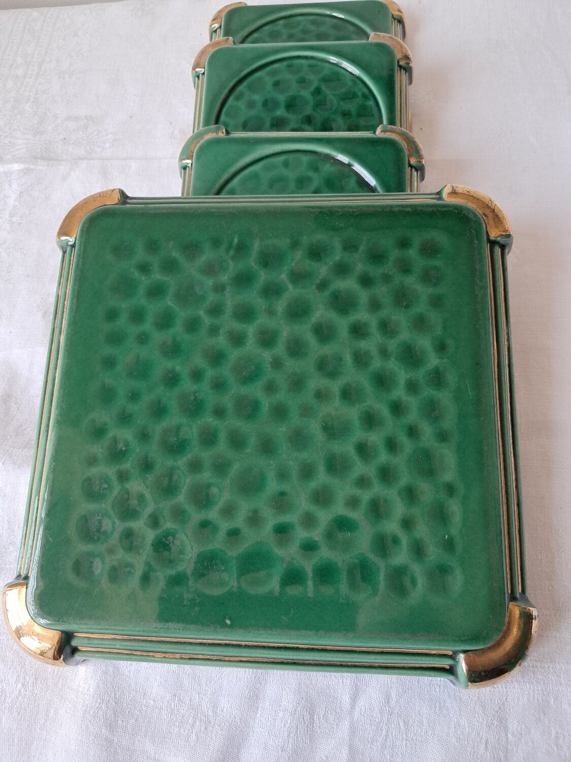 Ceramic trivets and glasses from Poët-Laval. Vintage