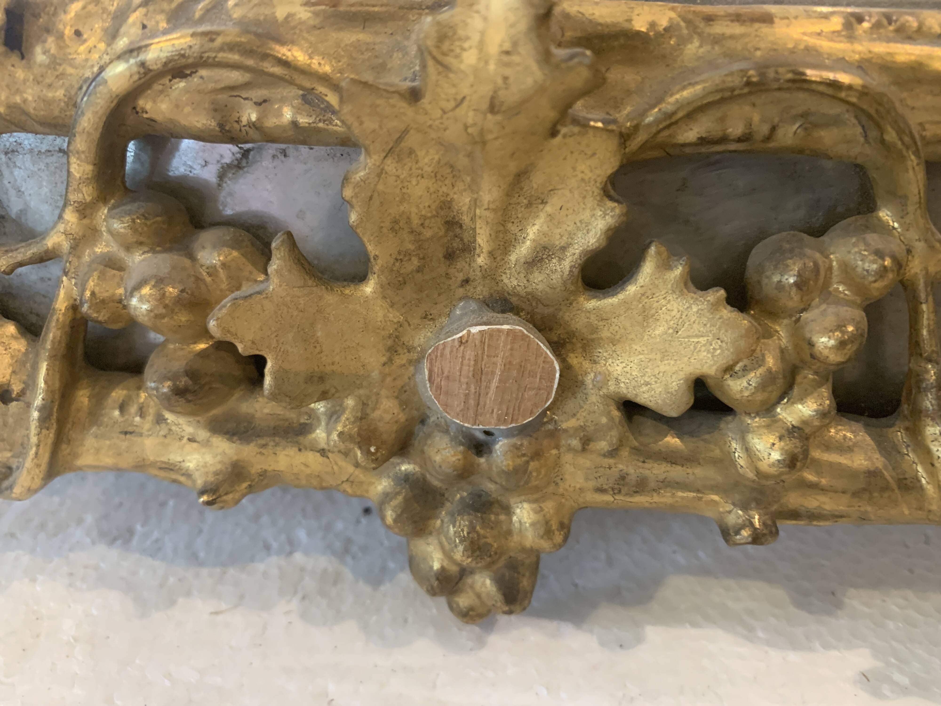 Louis XVI style mirror in carved wood and gilded with gold leaf, 19th century