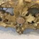 Louis XVI style mirror in carved wood and gilded with gold leaf, 19th century