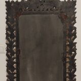 Mirror with its openwork frame