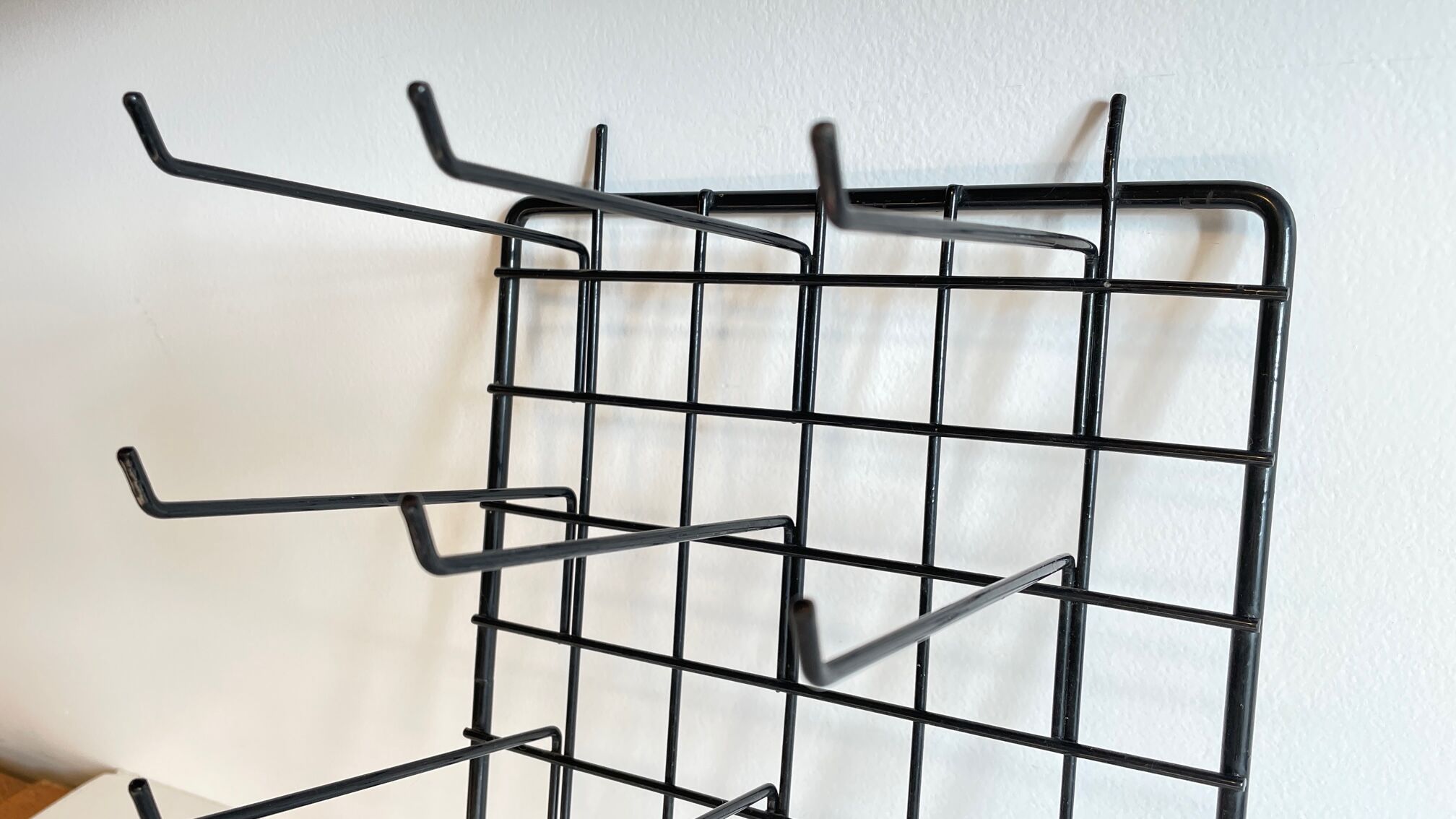 Vintage black metal wall loom display