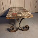 Base table in wrought iron thicken and tiled floor