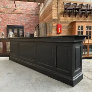 Immense bar counter covered with blue stone.