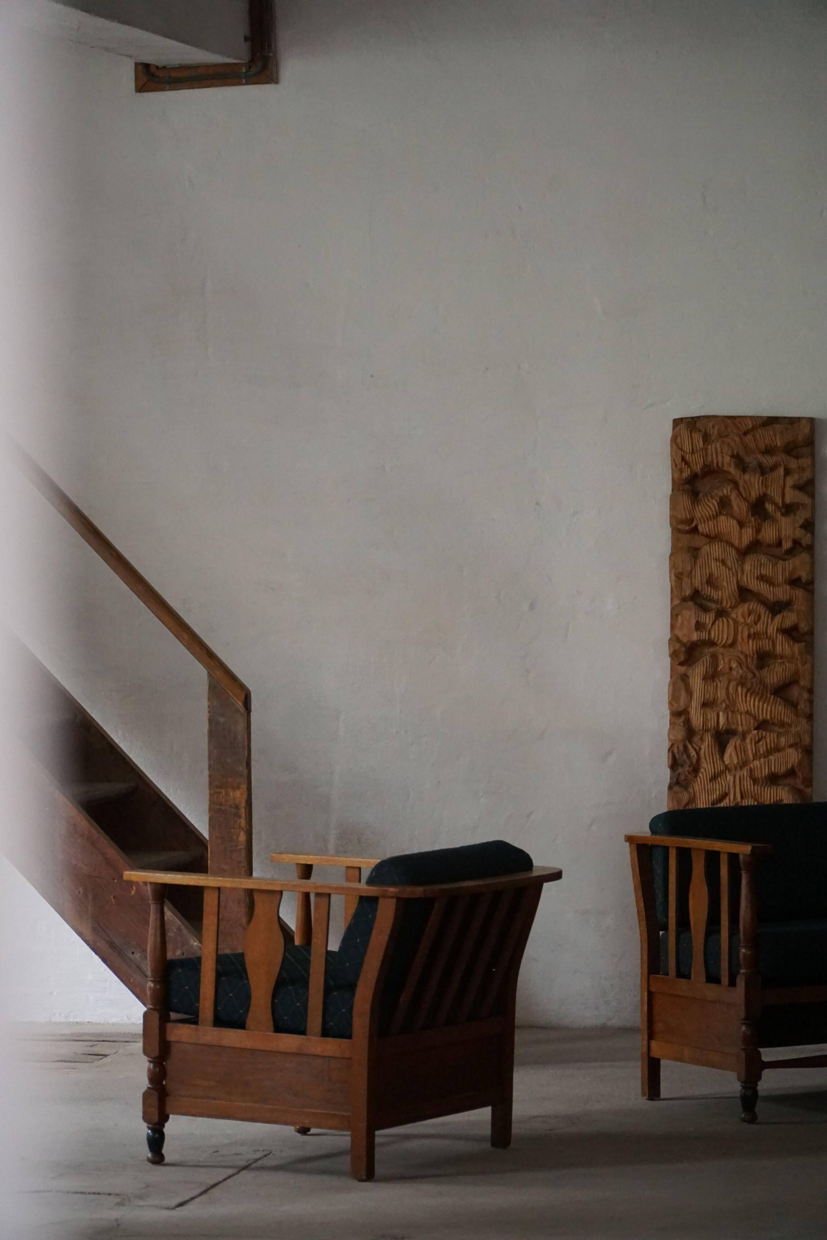 Art Nouveau, pair of oak lounge chairs, reupholstered in style fabric, 1920s.