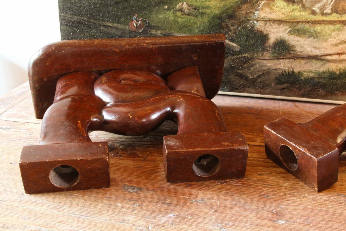 Pair of Art Deco carved wood candlesticks, signed Delaporte