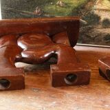 Pair of Art Deco carved wood candlesticks, signed Delaporte