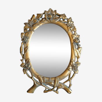 Golden resin mirror with floral decoration
