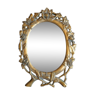 Golden resin mirror with floral decoration