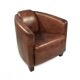 Brown leather club chair with its pouffe.