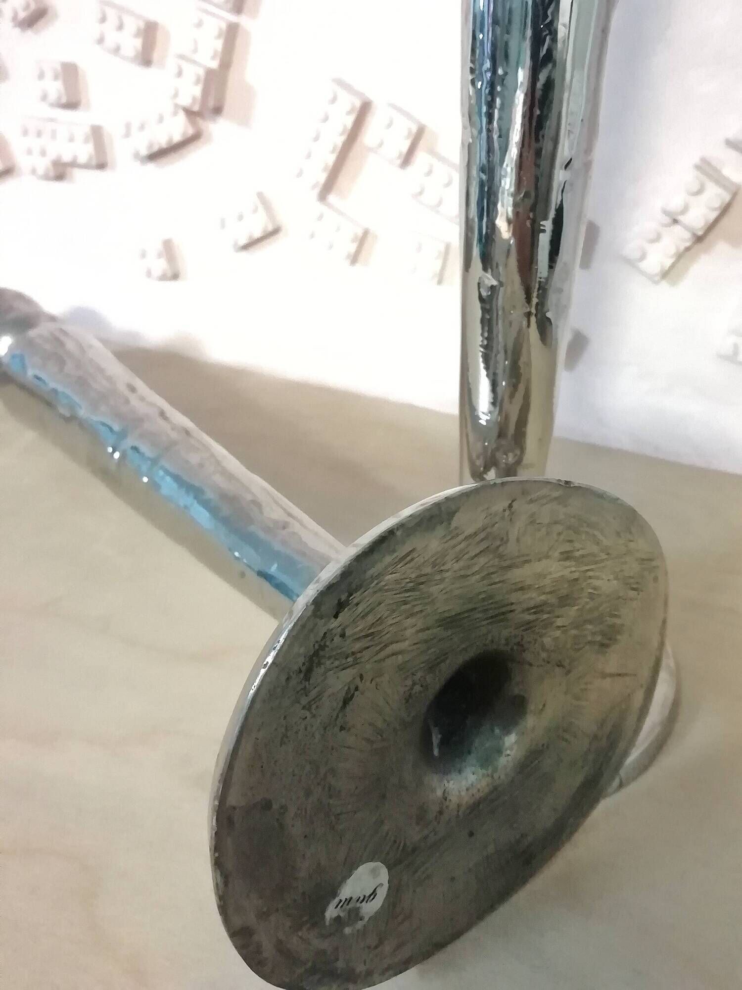 Pair of hammered metal candlesticks