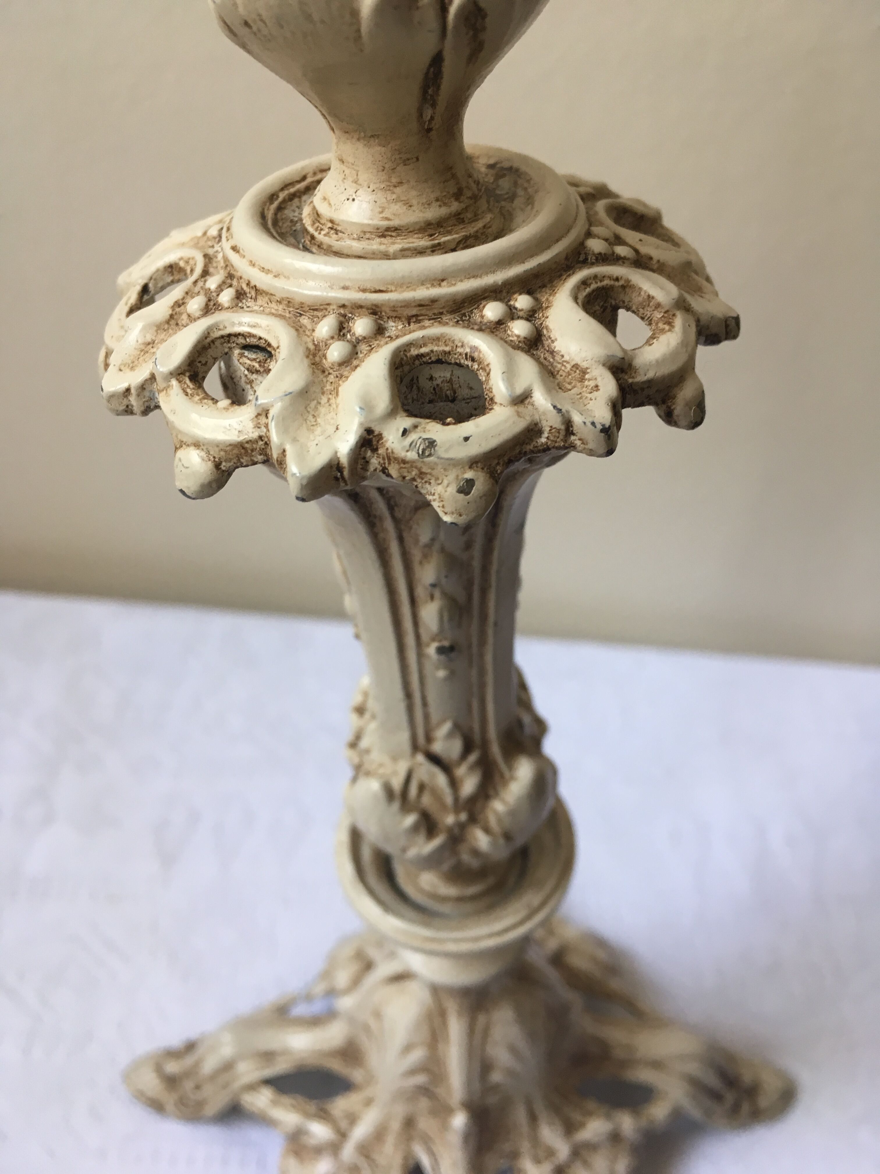 Large candle holder in patinated white painted metal