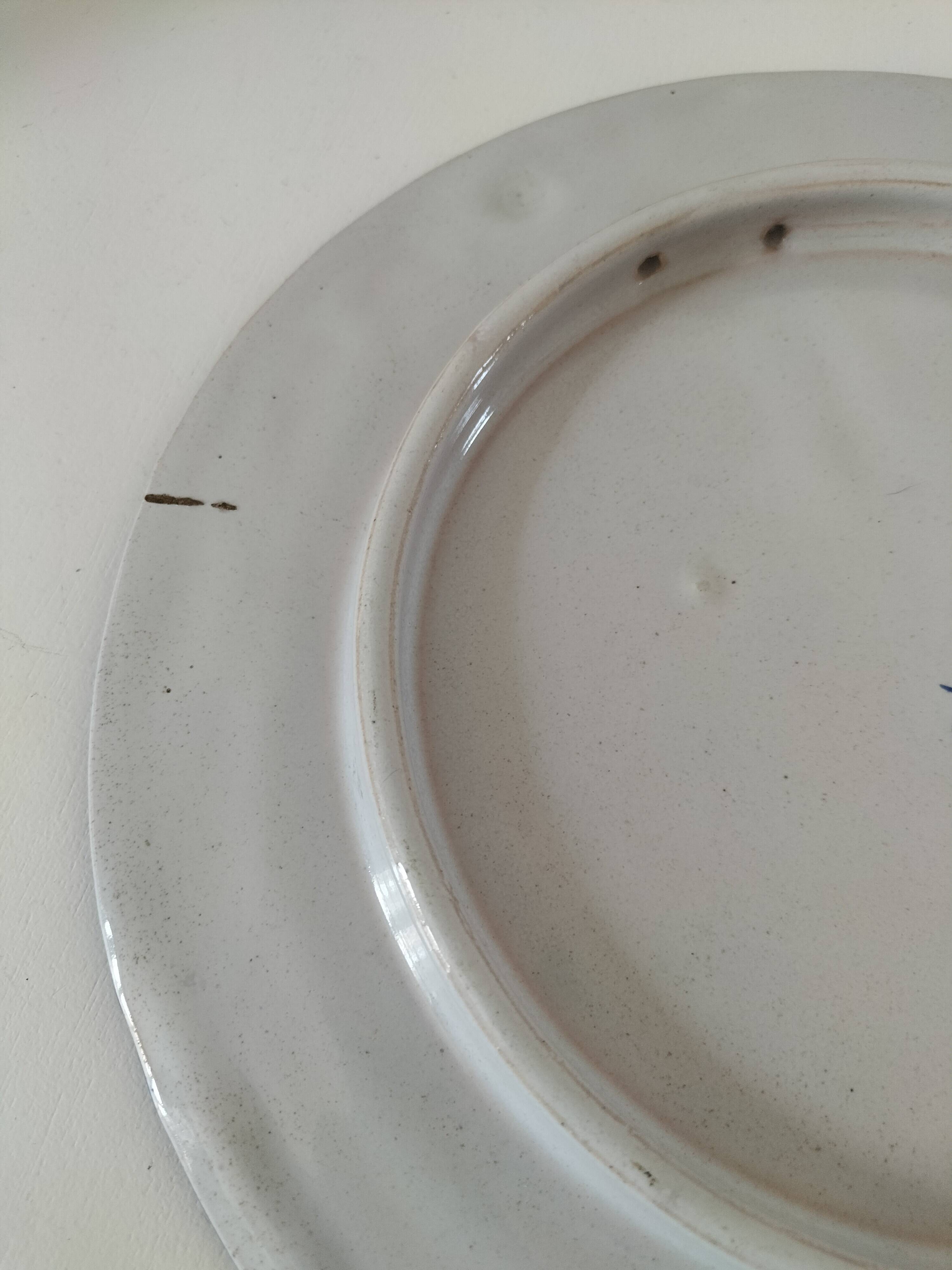 Decorative earthenware plate signed Charolles