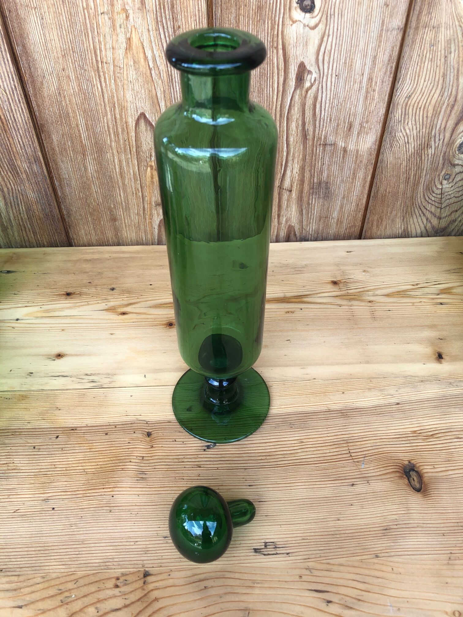 Green glass standing apothecary bottle