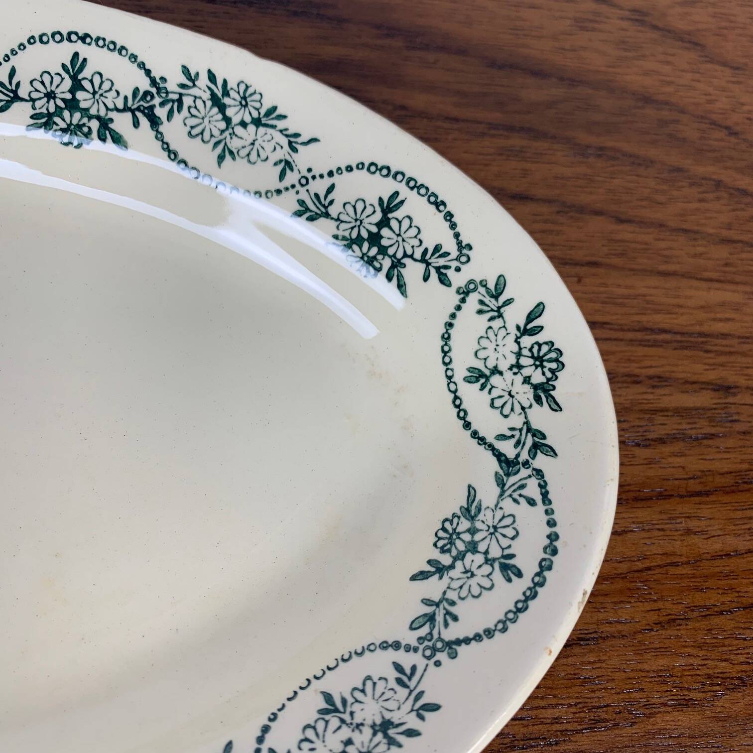 Small St Amand Ceranor dish, dark green flower pattern