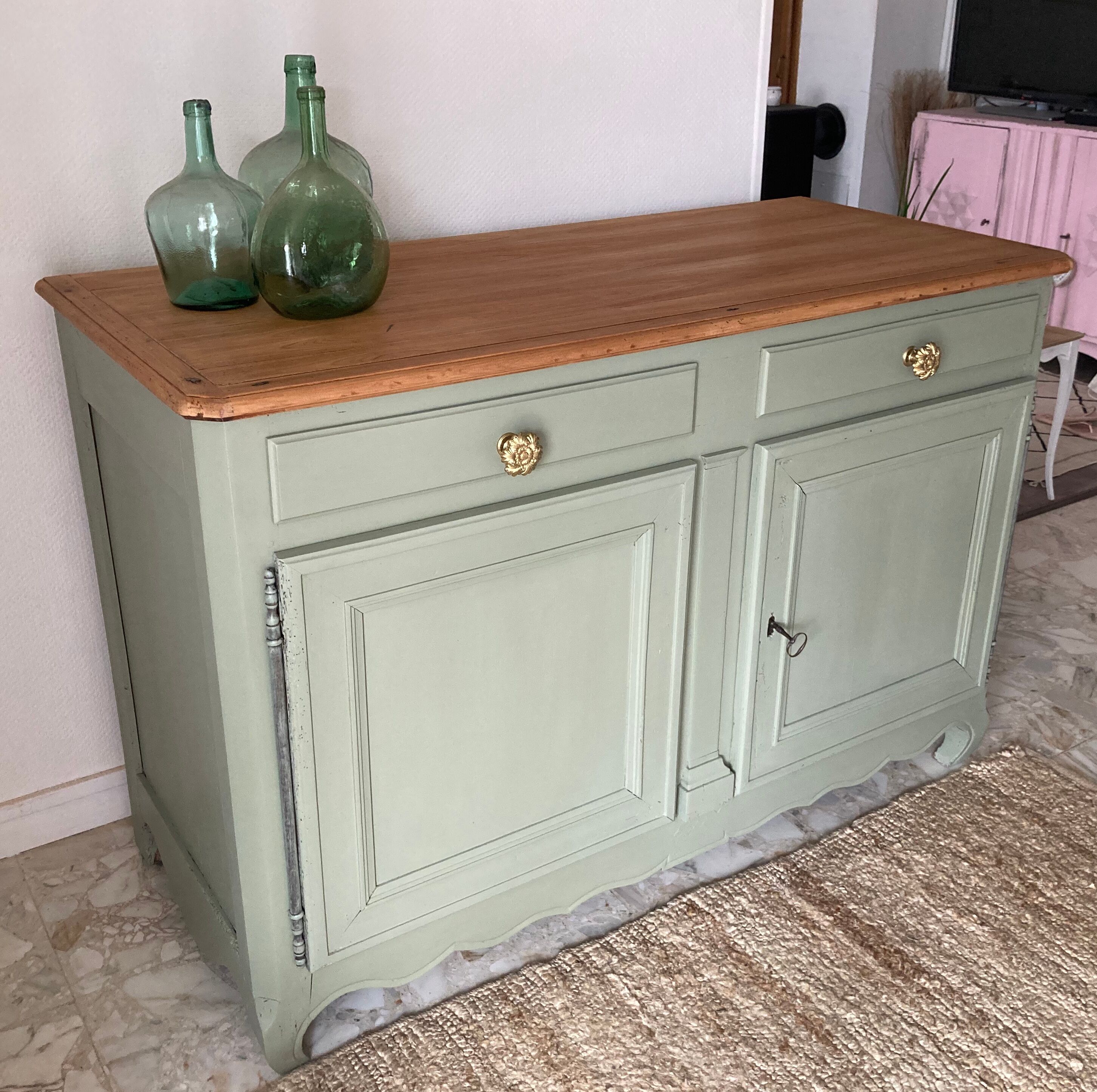 Pastel green low buffet, raw wood tray