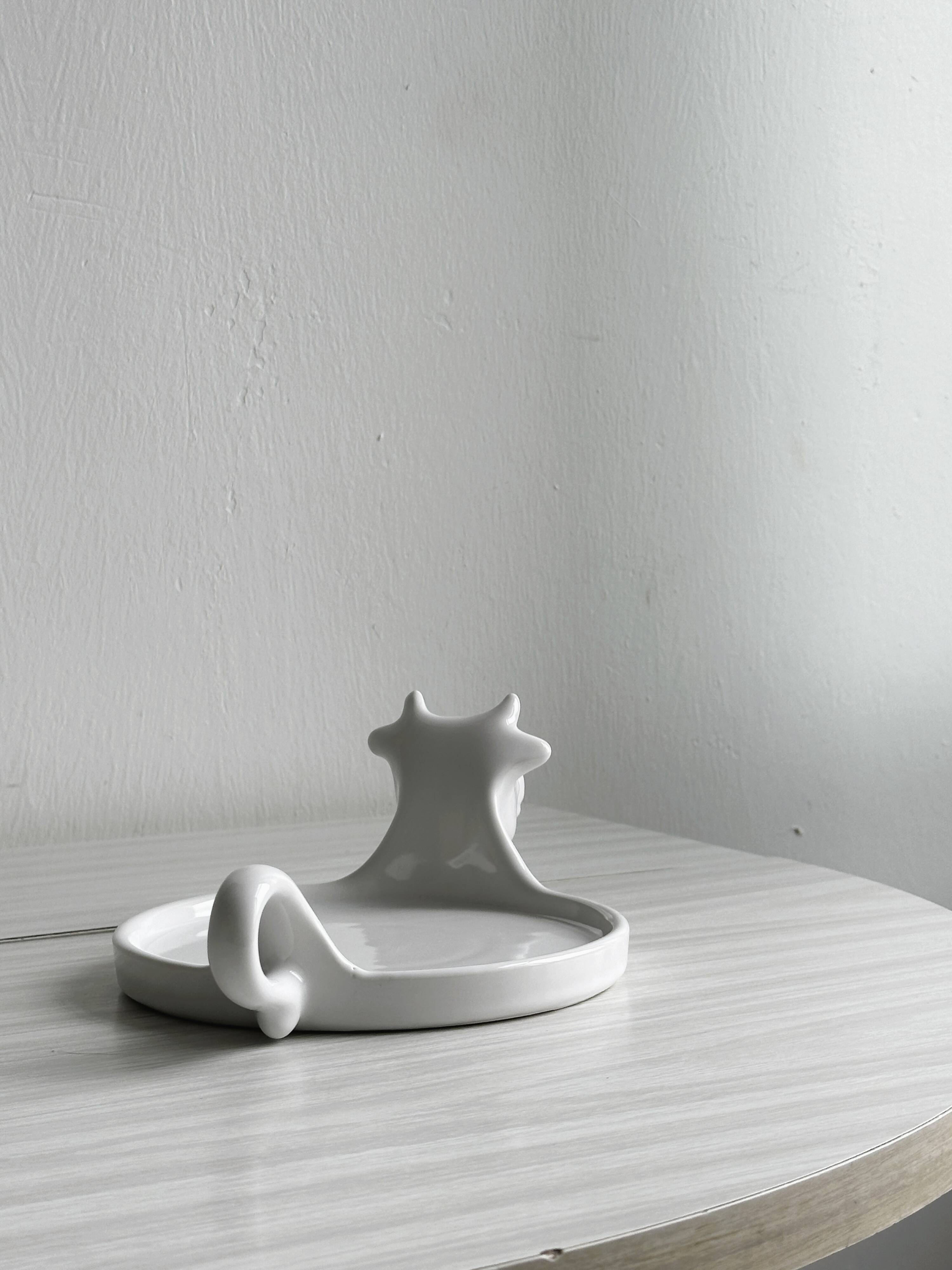 White porcelain cheese dish with handle and cow's head