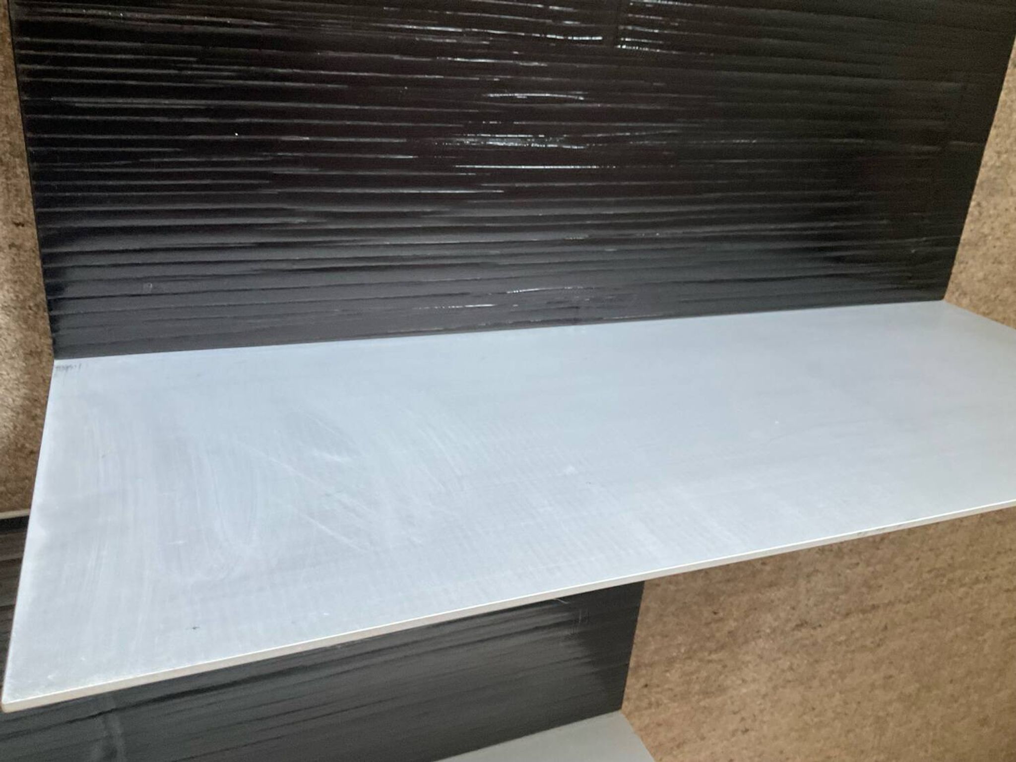 Pair of contemporary shelves in steel and stained wood
