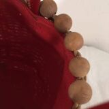 Wicker basket with a wooden bead border