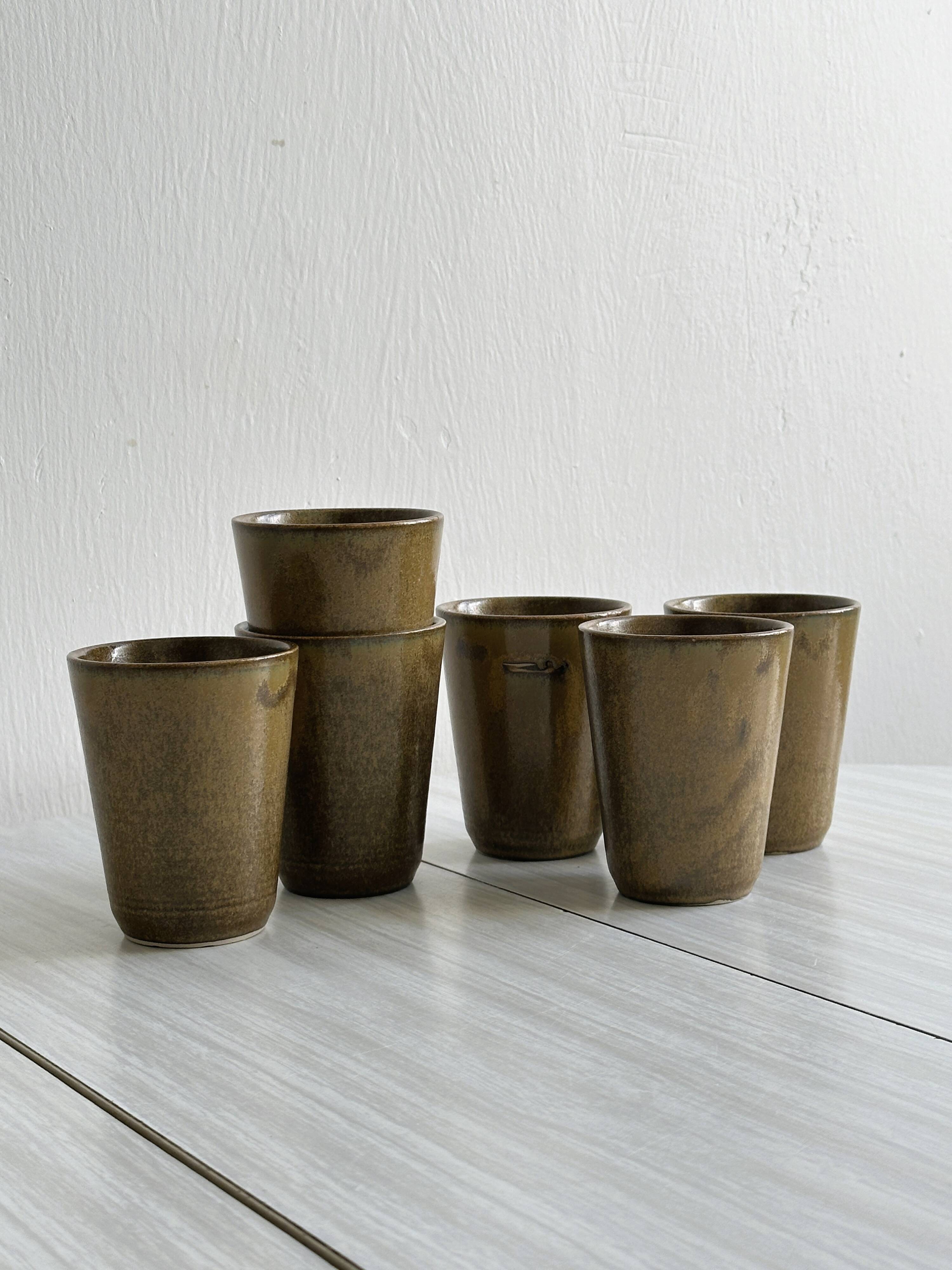 6 Digoin ceramic mugs.