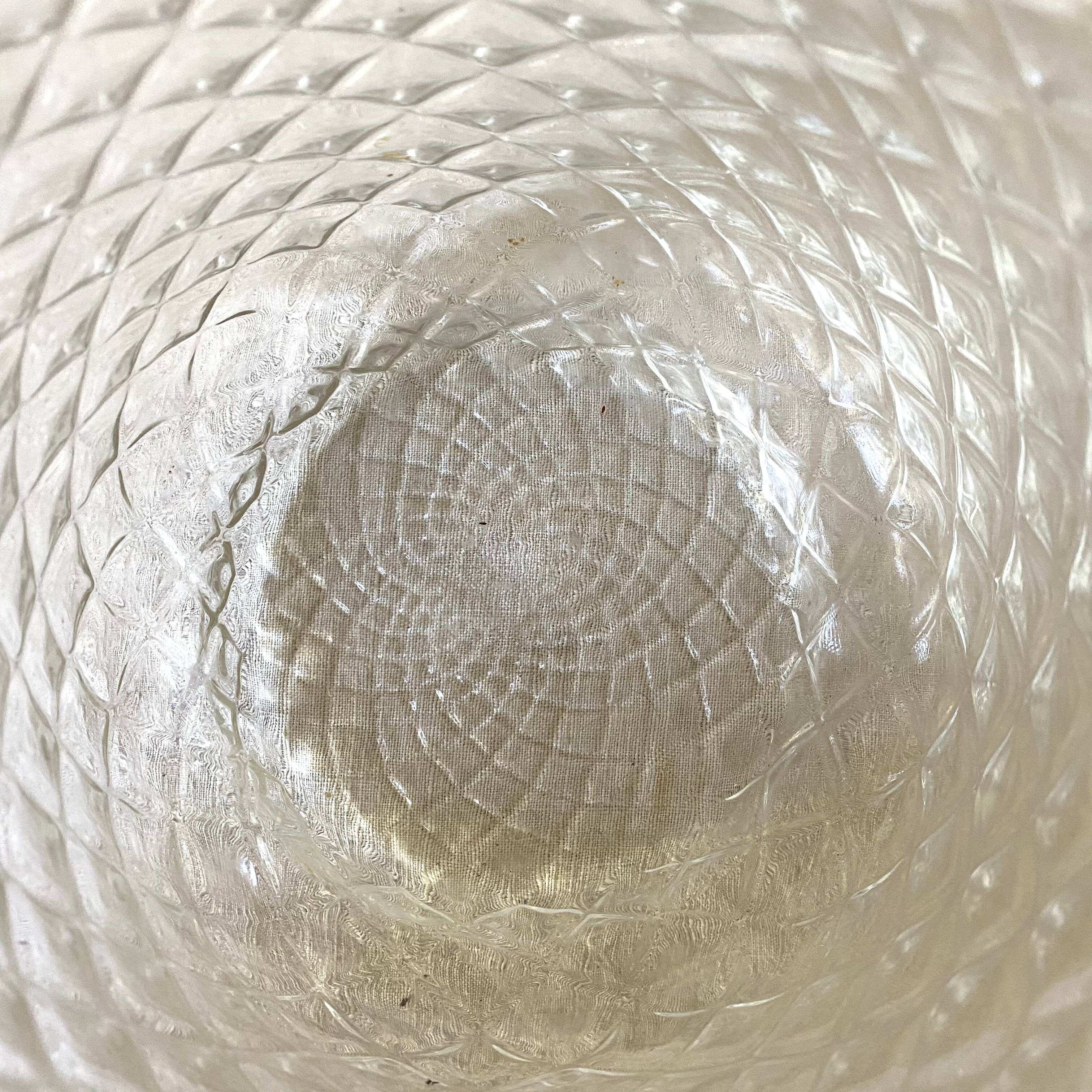 Old biscuit bucket in glass and metal