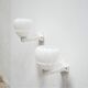 Pair of art deco porcelain and glass wall appliques