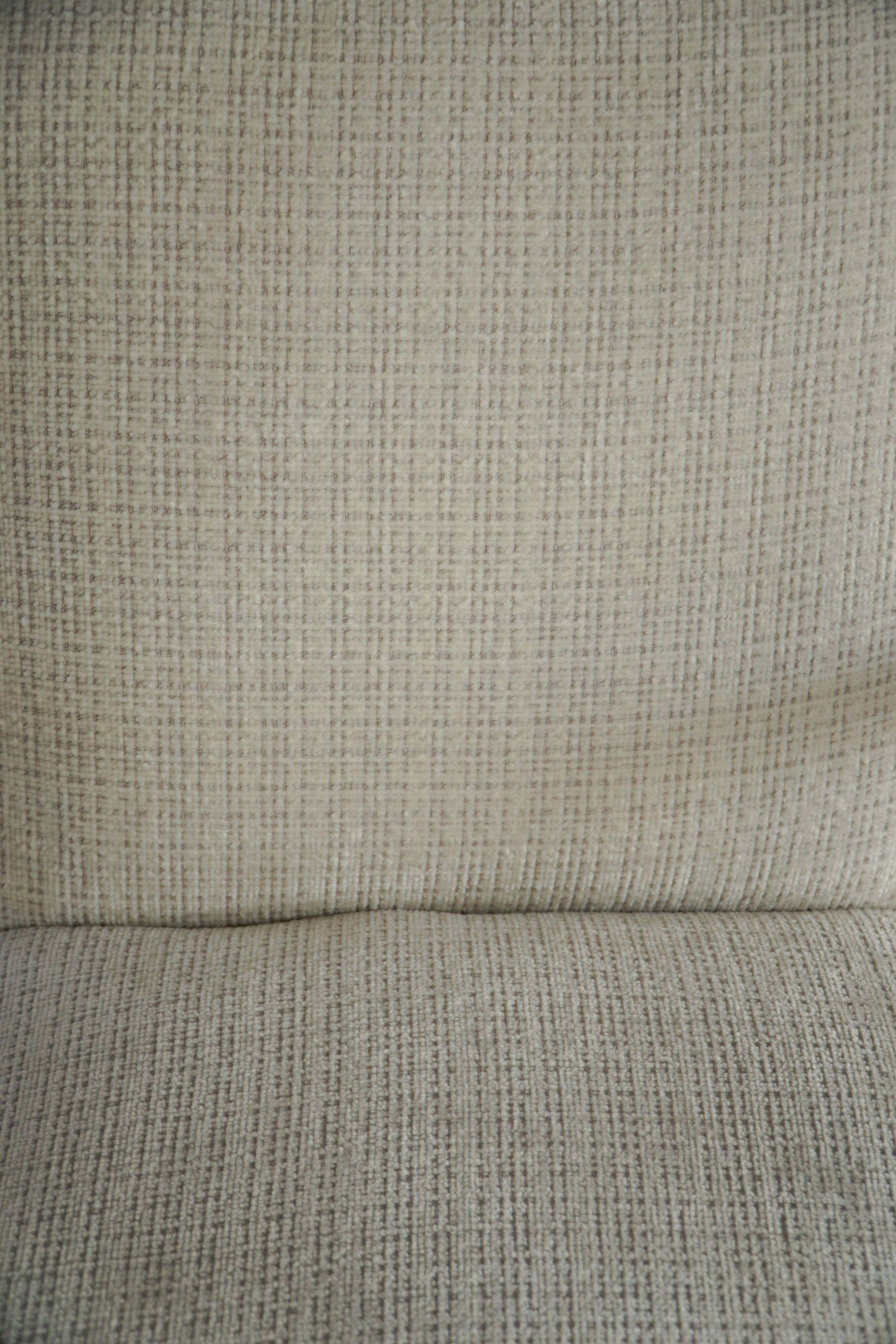 A pair of Swedish Art Deco lounge chairs with curved armrests, 1930s.