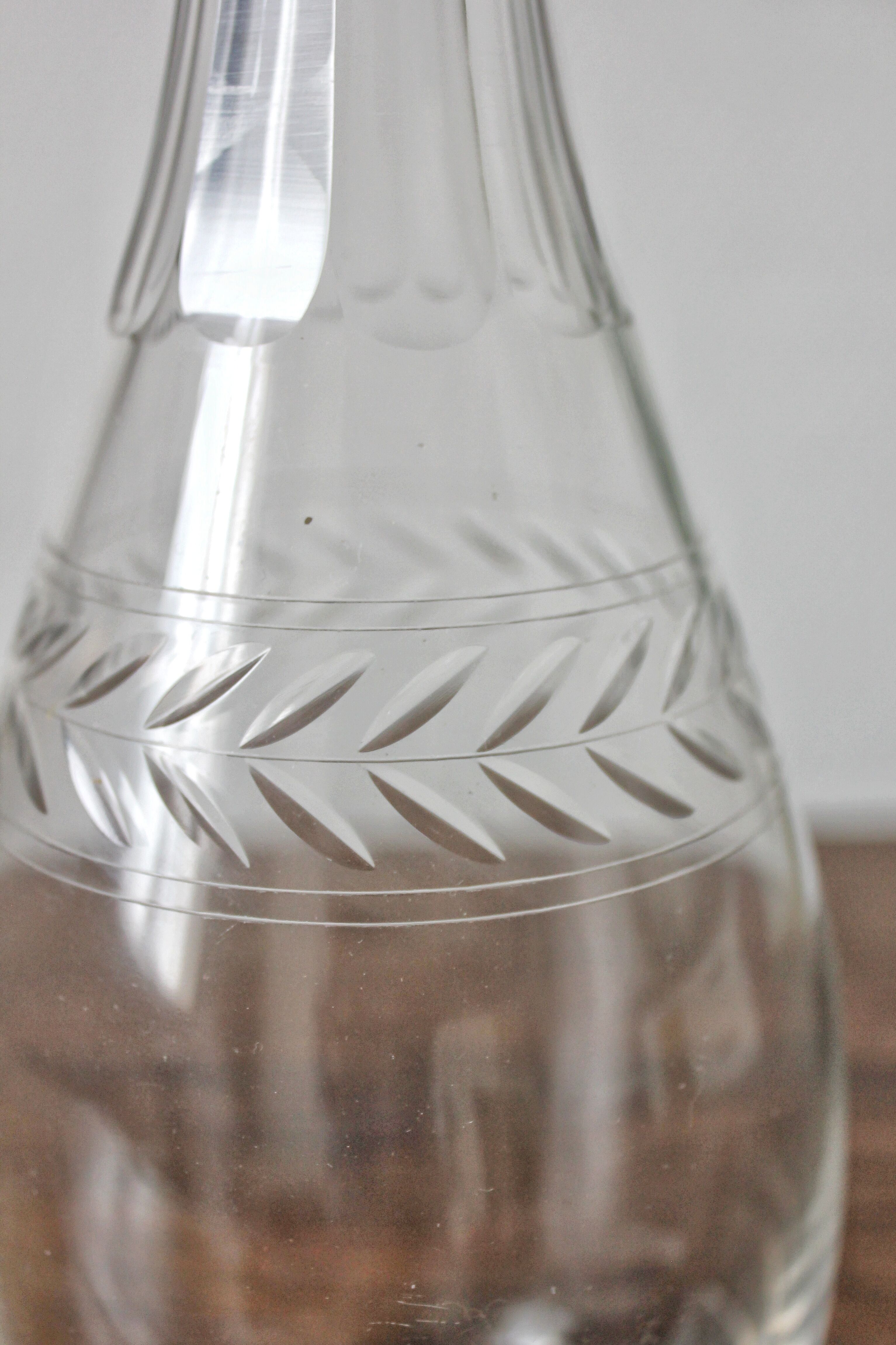 Antique crystal carafe engraved with a laurel leaf frieze