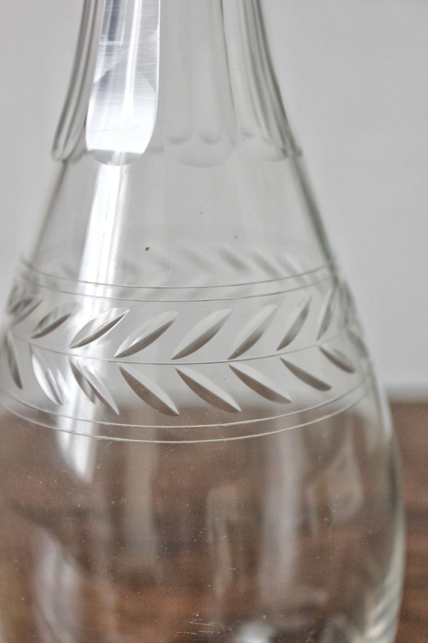 Antique crystal carafe engraved with a laurel leaf frieze