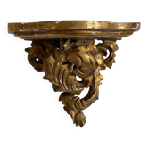 Antique wall console in wood and gilded stucco.
