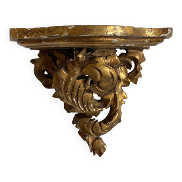 Antique wall console in wood and gilded stucco.
