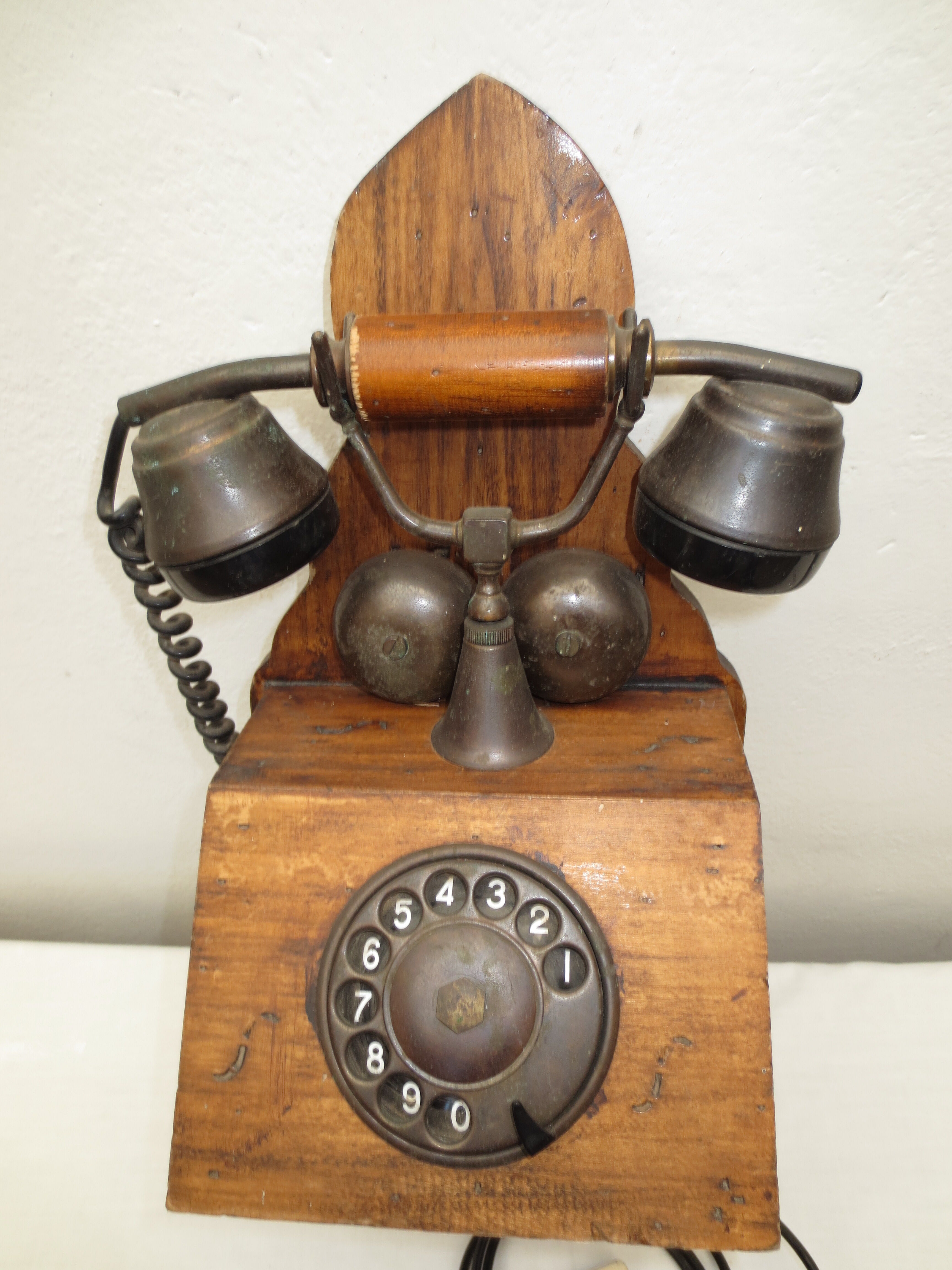 Old wood and metal wall phone