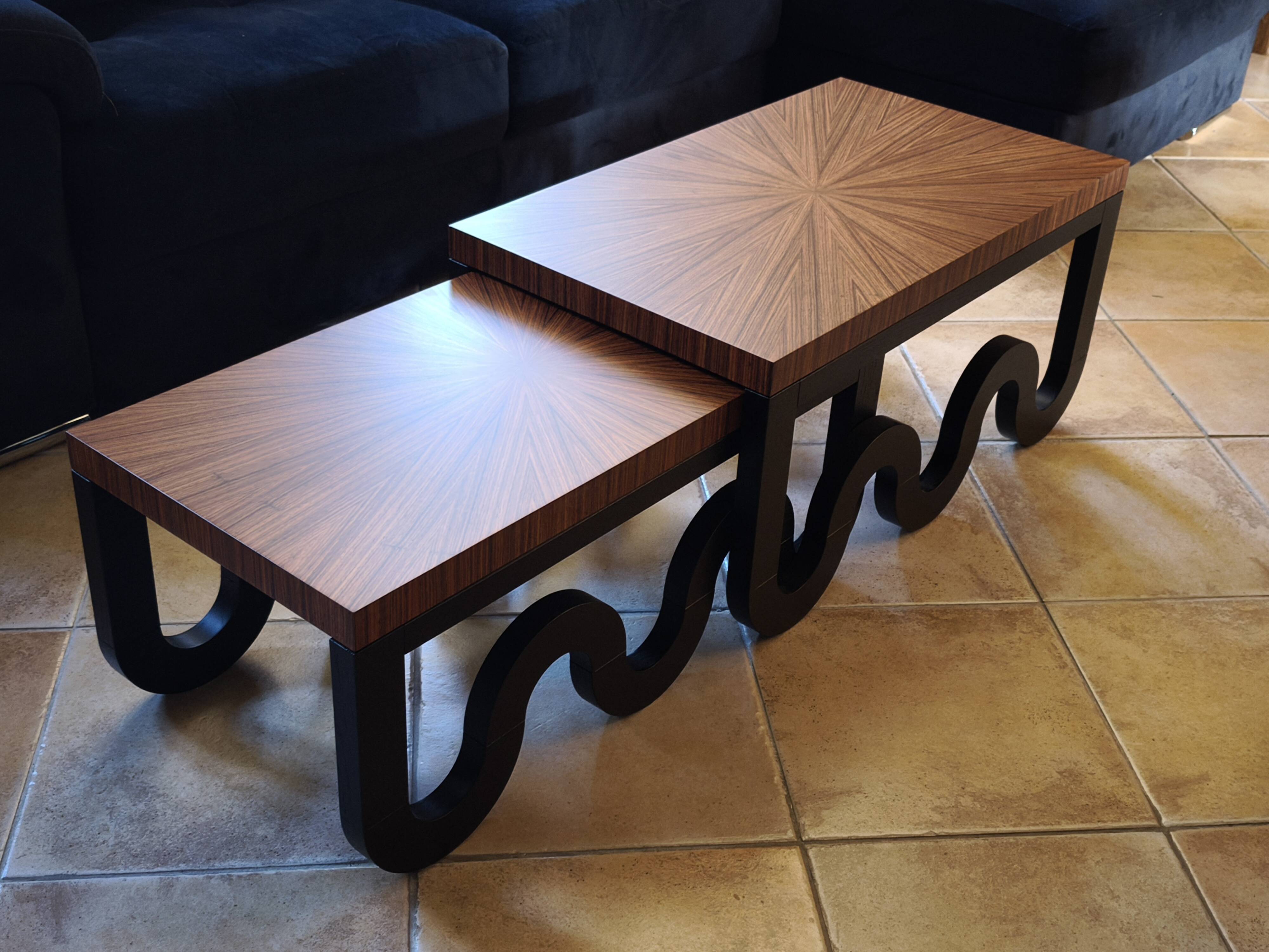 Nest of coffee tables in lacquer and rosewood veneer.
