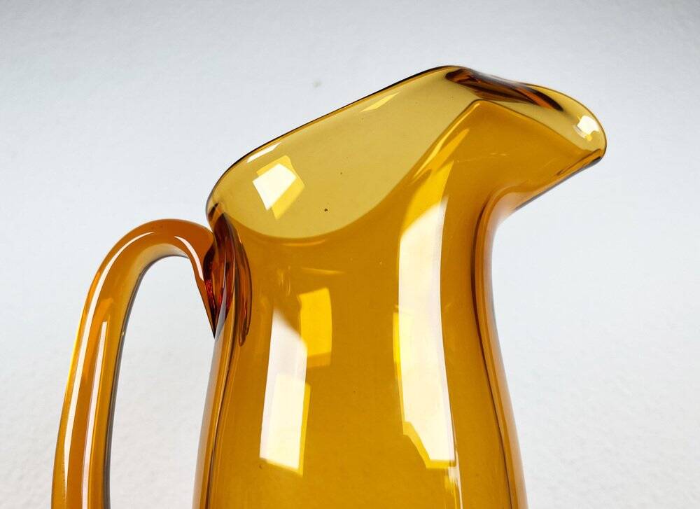 Amber glass carafe from the mid-century German Jagdhaus series and drinking glasses by Wilhelm Braun-Feldweg for Hirschberg, 1960s, set of 7.