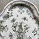 Oval Moustiers plate in cream and green earthenware, 18th century.