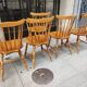 Four chairs and a Heywood Wakefield Windsor armchair. Vintage