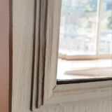 Old mirror patinated green of gray