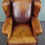 Armchair in patinated sheepskin leather