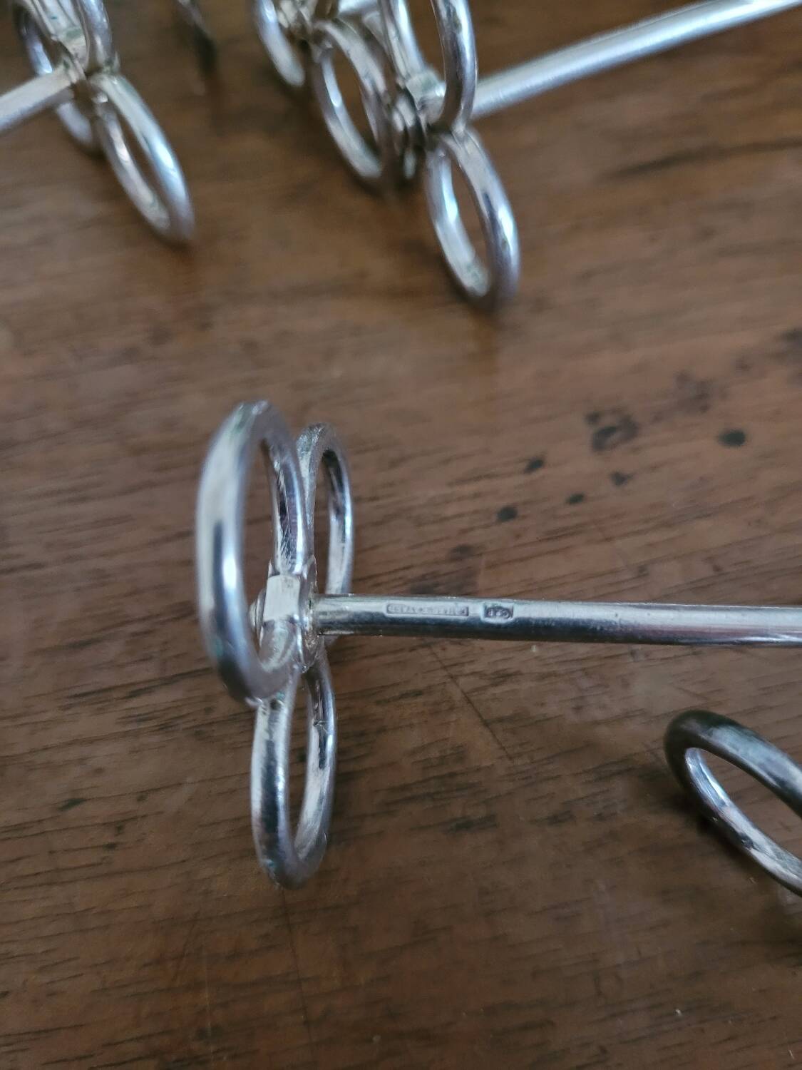 Set of 12 silver Cailar-Bayard knife rests