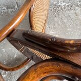 Warm walnut bentwood and cane child's rocking chair early 20th-century